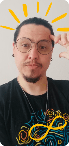 Ghael Leite é uma pessoa não binária com expressão de gênero masculina e traços indígenas, na foto tem pele caucasiana, com cabelos pretos presos, brinco pretos, utiliza óculos de armação redonda preta, uma um cavanhaque e bigode, camiseta preta com a estampa do quadro uma noite estrelada do Van Gogh, e por cima da foto tem pintado uma espécia de raios solares formando um coroamento e o símbolo do infinito pintado em amarelo.